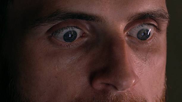 istock Gray eyes of surprised intelligent young man using his tablet 622183262