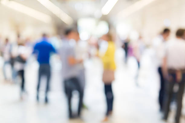 istock Abstract blurred people socializing during coffee break at business conference. 622183432
