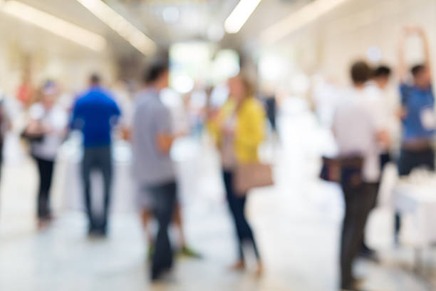 istock Abstract blurred people socializing during coffee break at business conference. 622183480