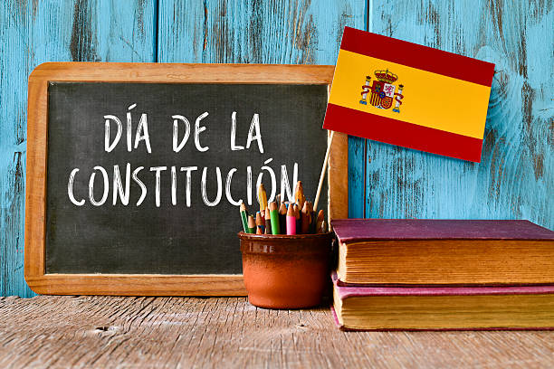 text constitution day written in spanish a chalkboard with the text dia de la constitucion, constitution day written in spanish, a pot with pencils, the flag of Spain and some old books, on a rustic wooden surface constitucion photos stock pictures, royalty-free photos & images