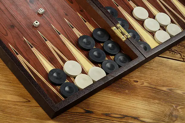 Color detail of a Backgammon game with two dice close up.