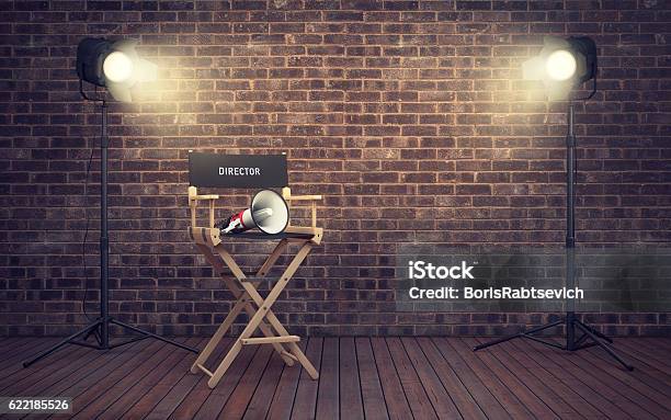 Film Directors Chair With Megaphone And Spotlights 3d Renderin Stock Photo - Download Image Now