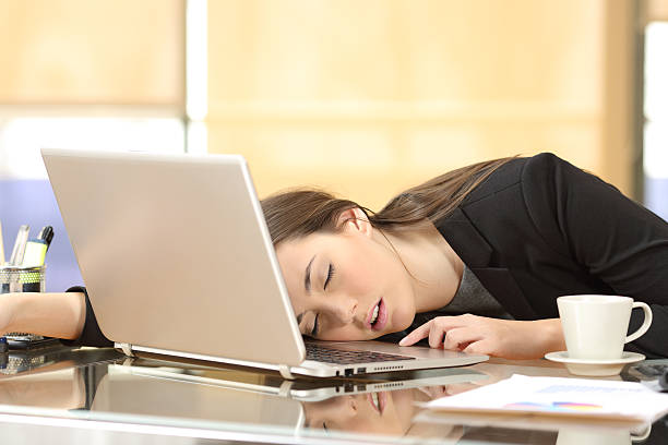 istock Overworked businesswoman sleeping at work 622185554