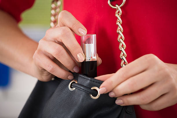 istock Woman Stealing Lipstick At Supermarket 622185568