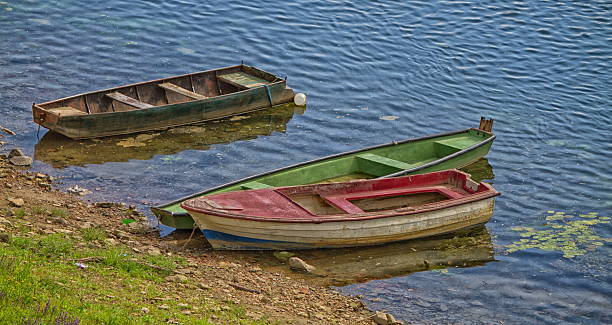 istock Three old boats along the river 622185736