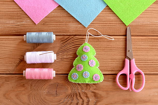 istock Green felt Christmas tree with pink and blue circles 622187076
