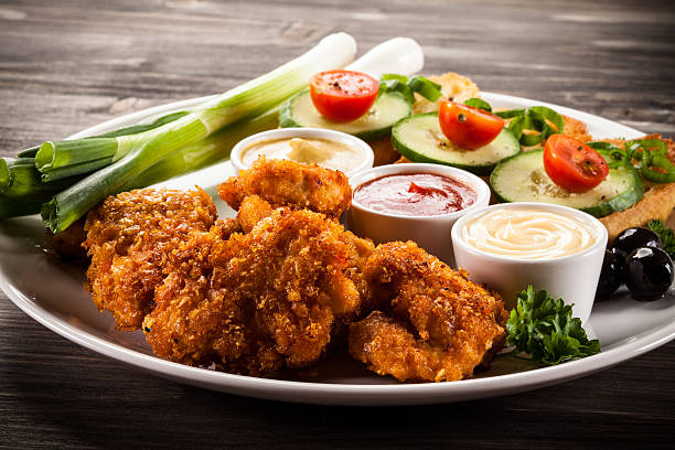 istock Chicken nuggets and vegetables 622187360
