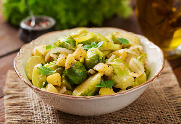 istock Stewed Brussels cabbage sprouts, apples and leeks in bowl. 622188126