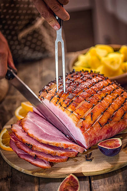 istock Carving Glazed Holiday Ham with Cloves 622188682