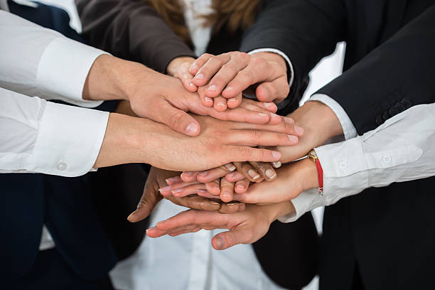 istock Businesspeople Hands Stacking Together 622189460
