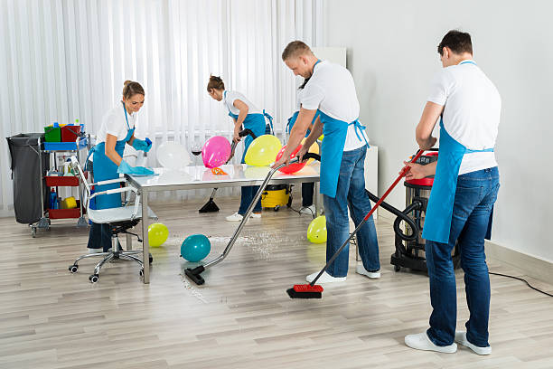Janitors Cleaning The Office After Party Group Of Male And Female Janitors Cleaning The Office After Party after party stock pictures, royalty-free photos & images