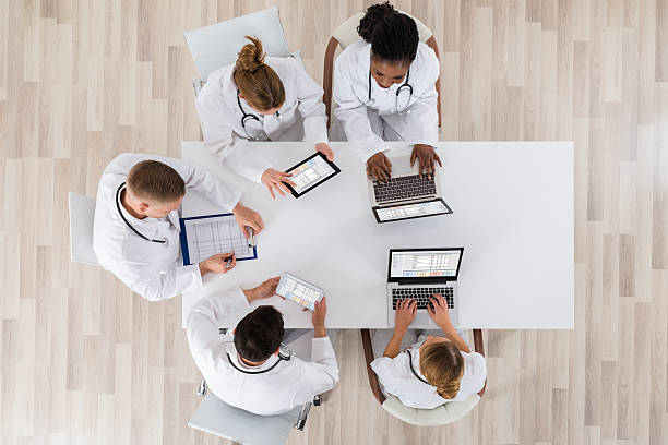 istock Doctors With Laptop And Digital Tablet In Meeting 622190096