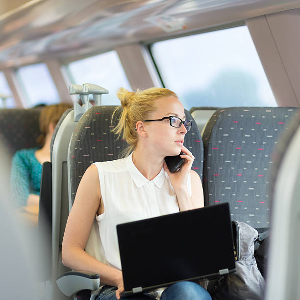 istock Business woman working while travelling by train. 622190652