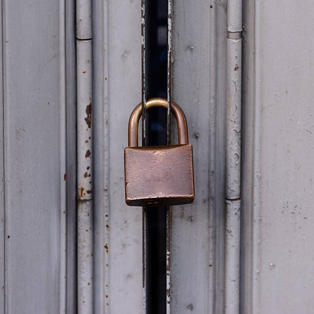 istock Locked door, grunge metal with rust doors. 622192774