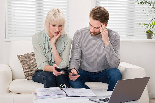 istock Unhappy Couple Calculating Bills 622194384