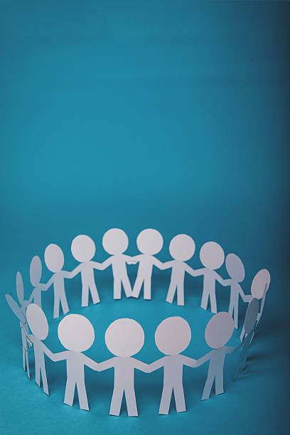 istock abstract paper people holding for hands 622195028