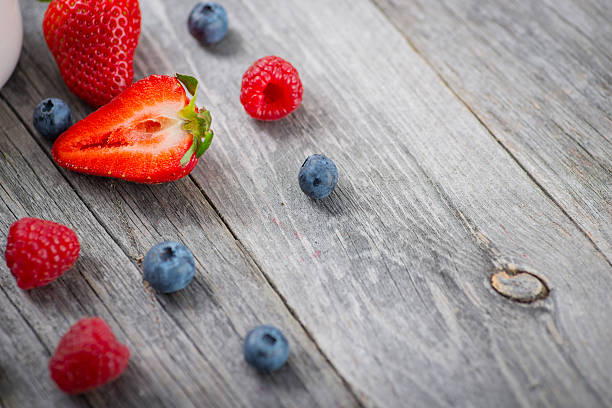istock Fresh and sweet natural berries on a wooden table 622195152