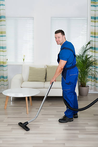 istock Worker Cleaning Floor With Vacuum Cleaner 622198228