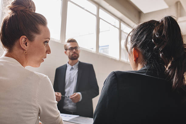 istock Two young woman discussing during in a meeting 622198312