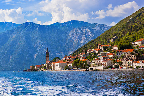 Village Perast on coast of Boka Kotor bay - Montenegro Village Perast on coast of Boka Kotor bay - Montenegro - nature and architecture background montenegro stock pictures, royalty-free photos & images