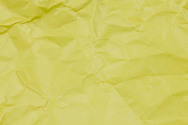istock texture of crumpled yellow paper. 622200500