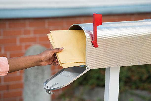 istock Person Putting Letters In Mailbox 622200554