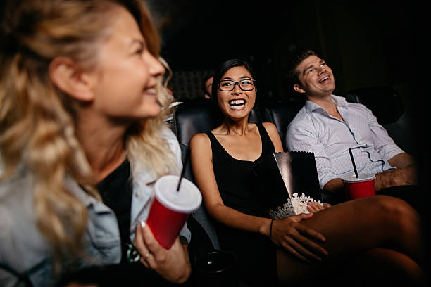 istock Young woman with friends watching 622200816