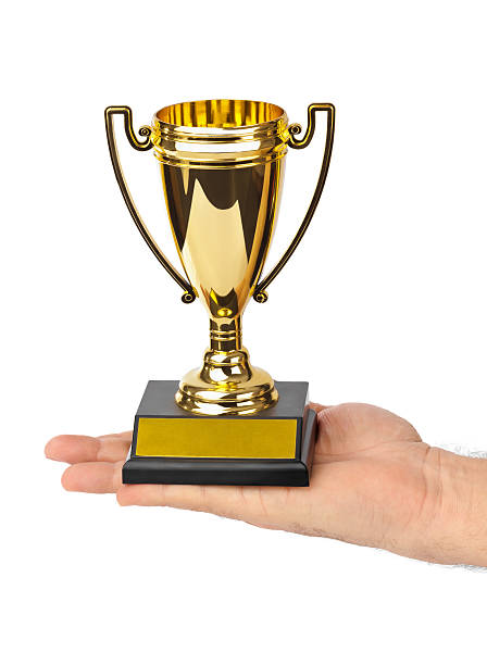 istock Golden trophy cup in hand 622202962