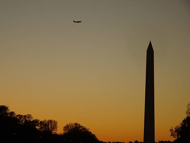 istock silhouette of the washington monument through the trees 622206276