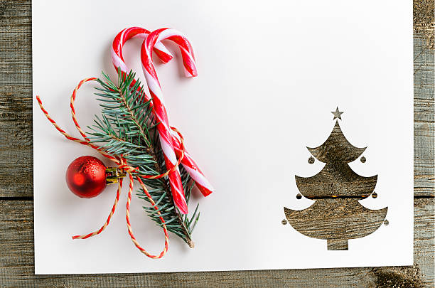 cut paper in fir-tree shape on table - new years eve christmas paper christmas fir tree imagens e fotografias de stock