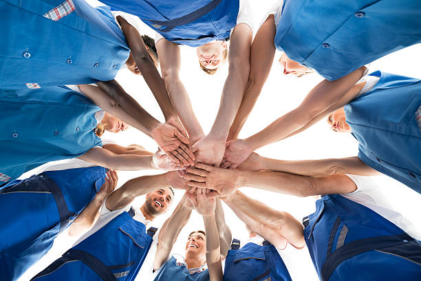 istock Directly Below Shot Of Janitors Stacking Hands In Huddle 622207730
