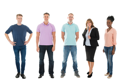 Full length portrait of creative business people standing with manager against white background