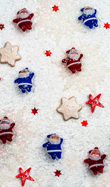 istock Santa Clauses small red and blue on a white background 622209204