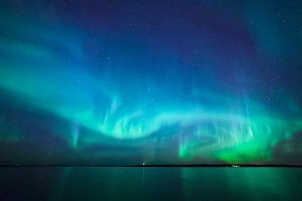 Northern lights over lake in finland