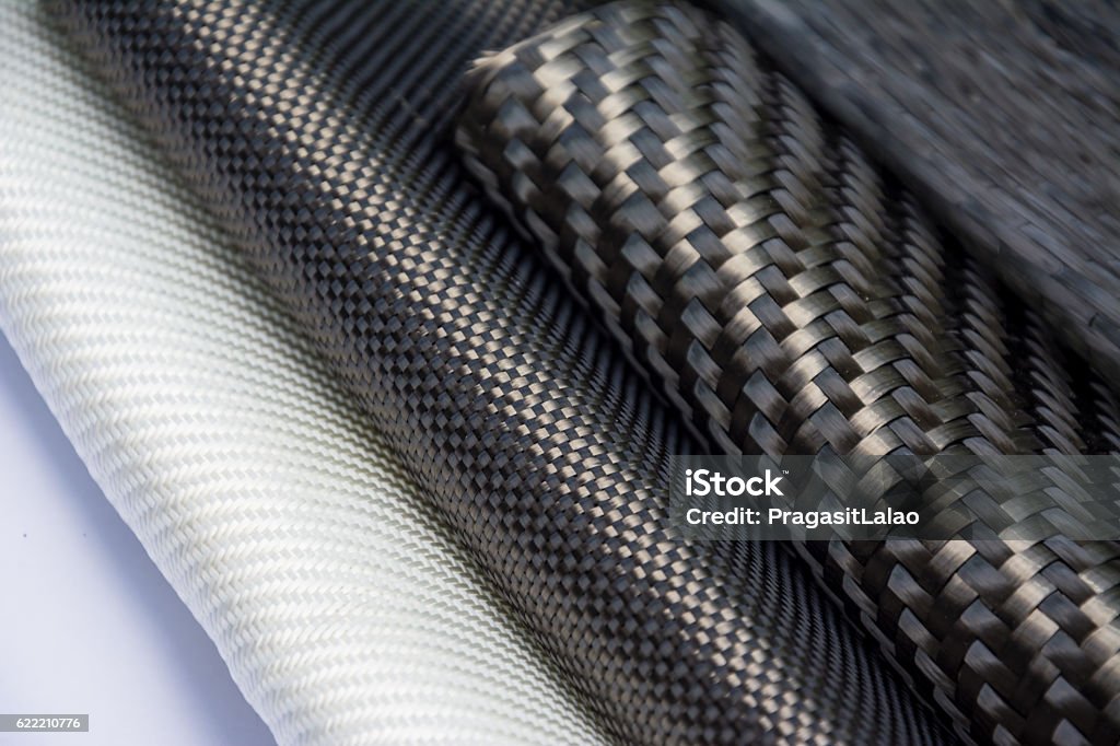 Carbon fiber composite raw material Black carbon fiber composite product material background Composite Image Stock Photo