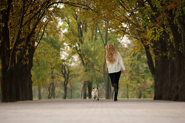 istock girl plays with a dog 622211256