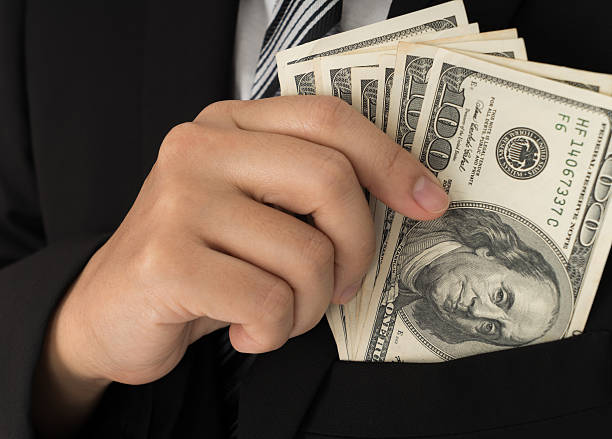 istock One hundred dollar bills in pocket 622212222