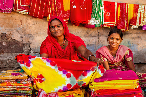 istock Indian women selling colorful fabrics 622212298