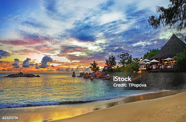 Cafe On Tropical Beach At Sunset Stock Photo - Download Image Now - Restaurant, Seychelles, Beach