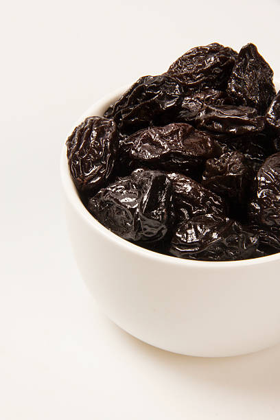 istock Dried plums in bowl. 622213606
