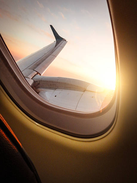 istock Sunlight from the porthole on airplane 622215214