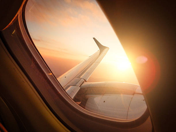 istock Sunlight from the porthole on airplane 622215558