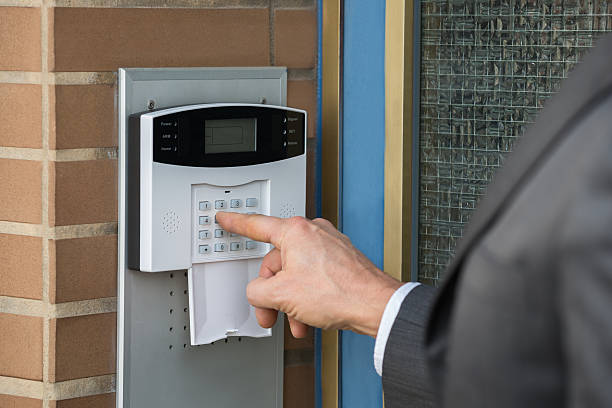 istock Close-up Of Businessperson Entering Code In Security System 622215702