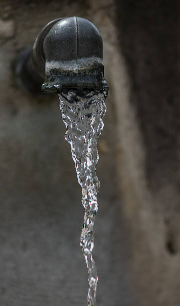 istock The jet of drinking water from the spring crane 622218026
