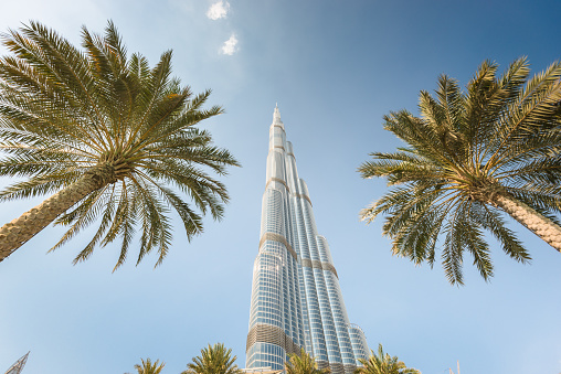 Dubai, UAE - October 30, 2014: Low angle view of the Burj Khalifa in the city of Dubai on downtown dubai district. the Burj Khalifa tower is the tallest building in the middle east. Sunny day.