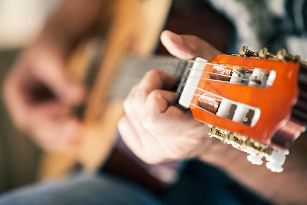 istock Adult Man Playing on Acoustic Guitar 622220094