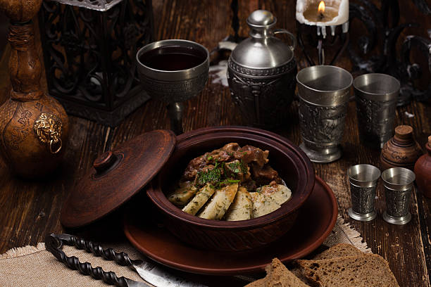 istock roast potatoes with meat in pot 622221358