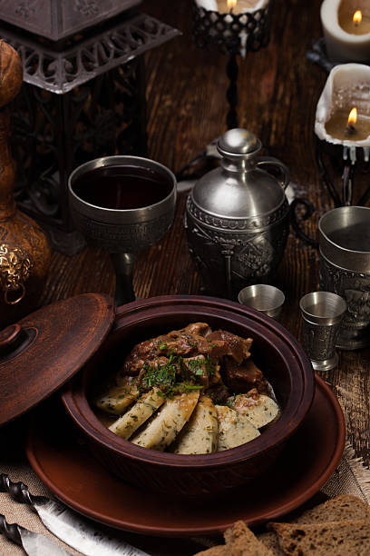 istock roast potatoes with meat in pot 622221470