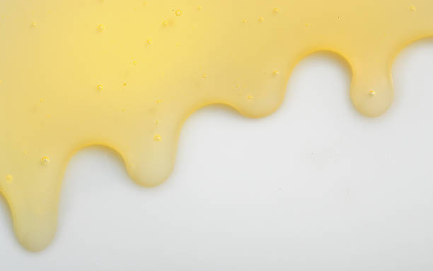 istock Honey liqiud flowing down 622223388
