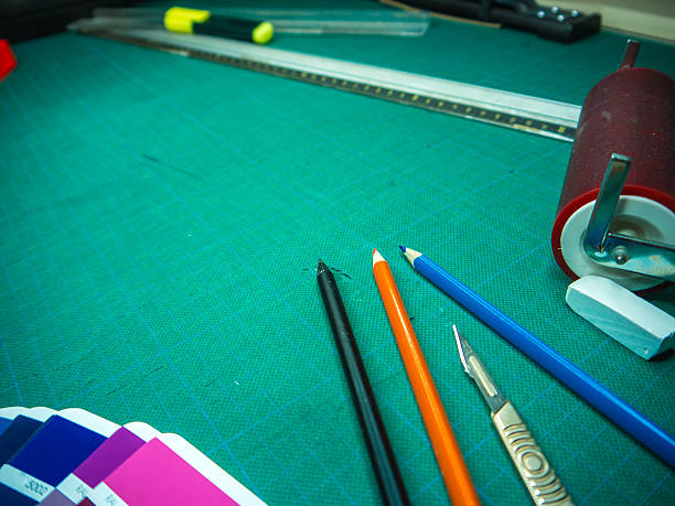 istock Cutting mat with various stationary tools, shot from above 622223464